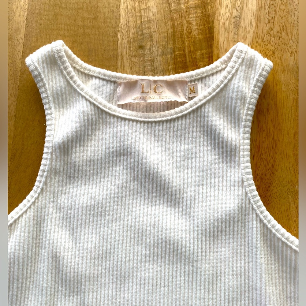 Cut sleeve high neck Body Suit cream NWOT sz M